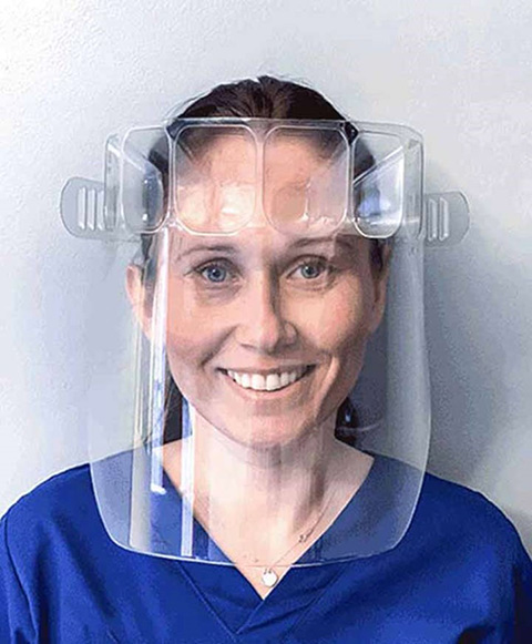 Photo of a woman wearing a face shield