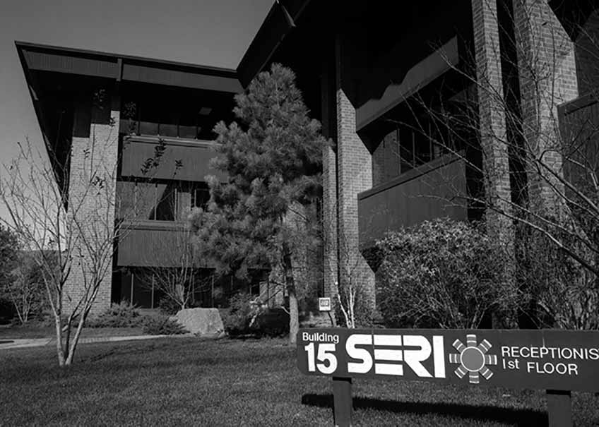 A black and white photograph of an old office building labeled SERI.