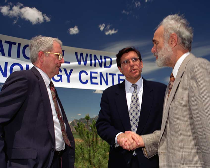 A photograph of men shaking hands.