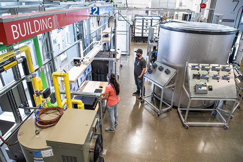 NREL researchers work in the Optical Characterization and Thermal Systems lab.