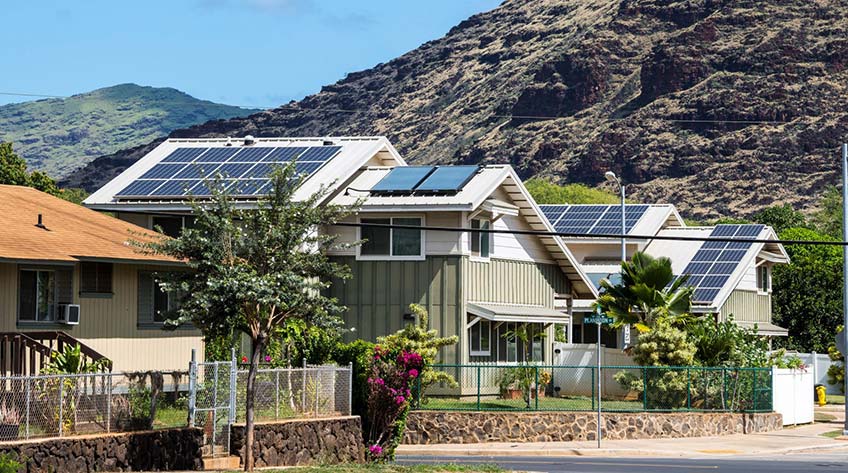Photo of solar panels on rooftops in Hawaii.