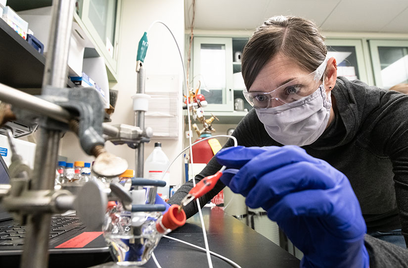 Photo of a researcher working at a lab bench