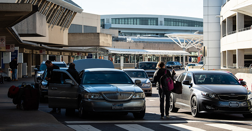 Photo outside of Dallas-Fort Worth International Airport, where passengers unload and load into cars.