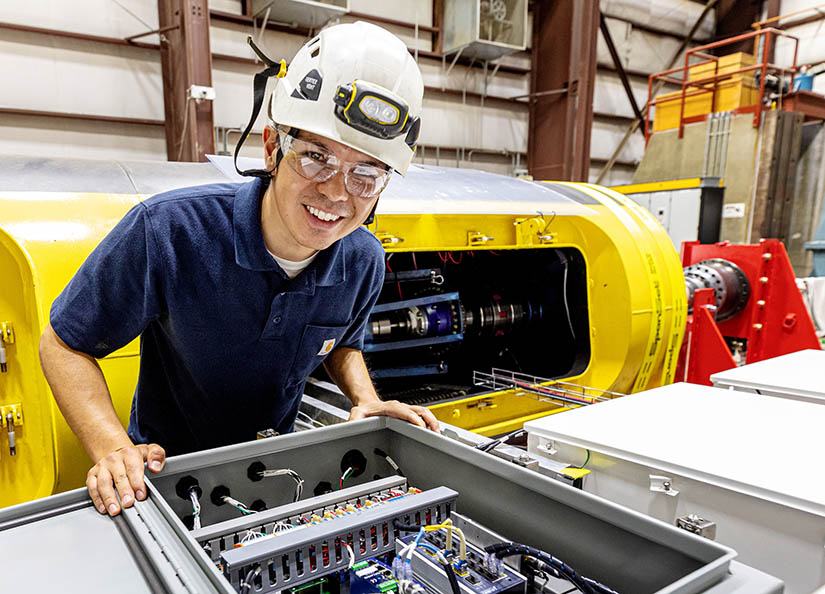 A researcher in front of data equipment