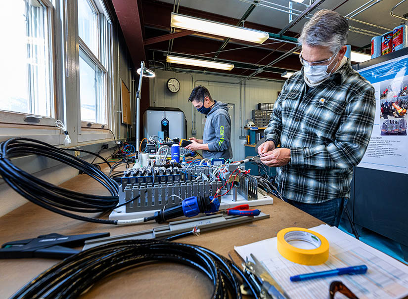 Researchers checking equipment