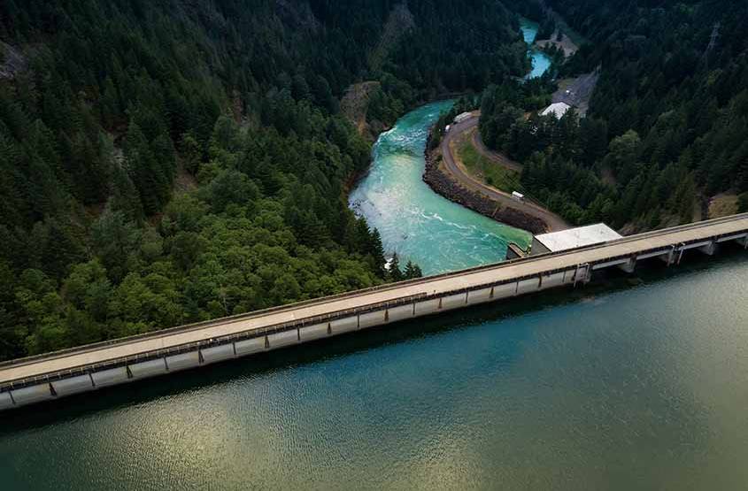 Overhead view of a river, dam, and reservoir