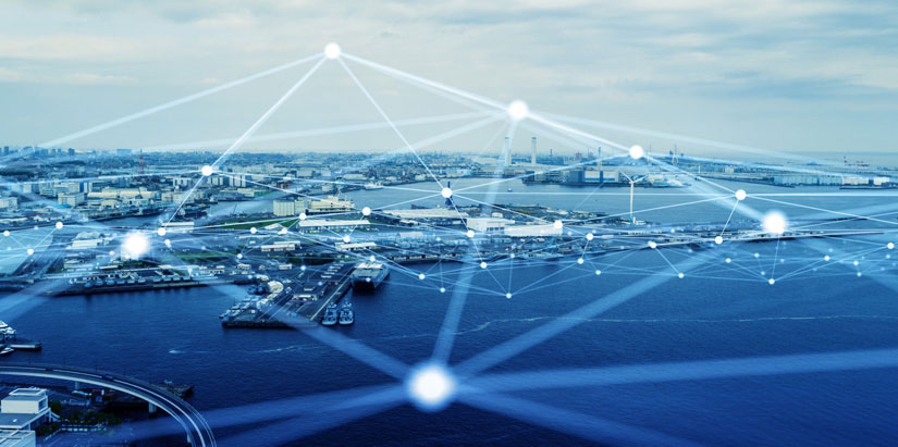 Image of a port city with digital lines overlaid demonstrating wireless connections.