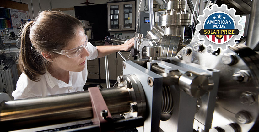 A woman working with machinery in a lab.