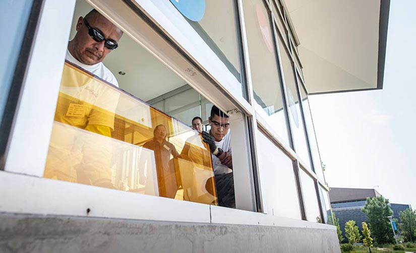 Men installing a window.