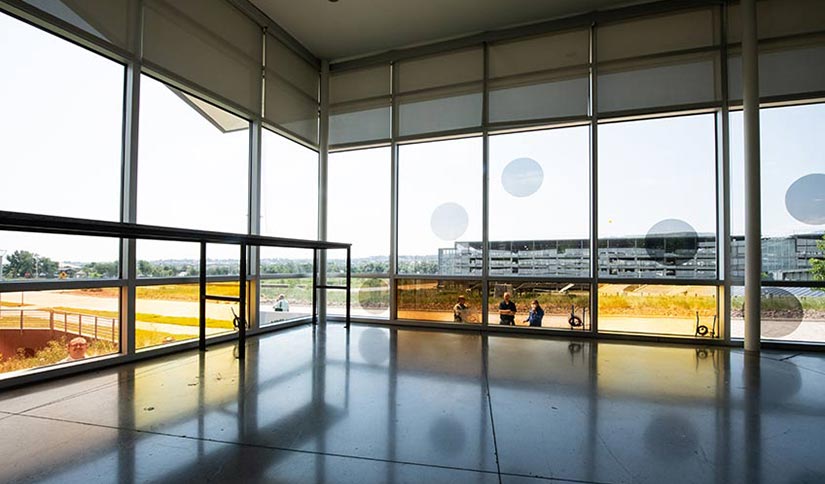 A picture of a building's windows taken from the interior.