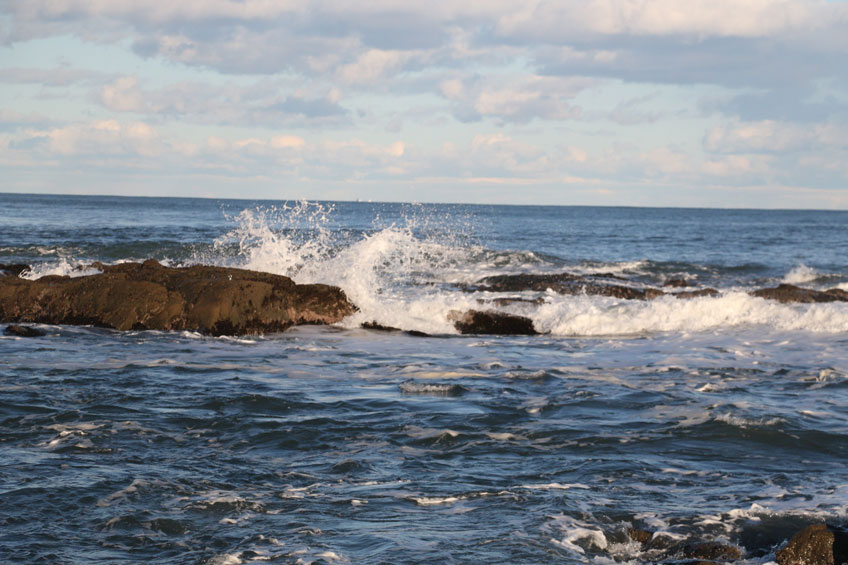 Ocean waves crashing against rocks