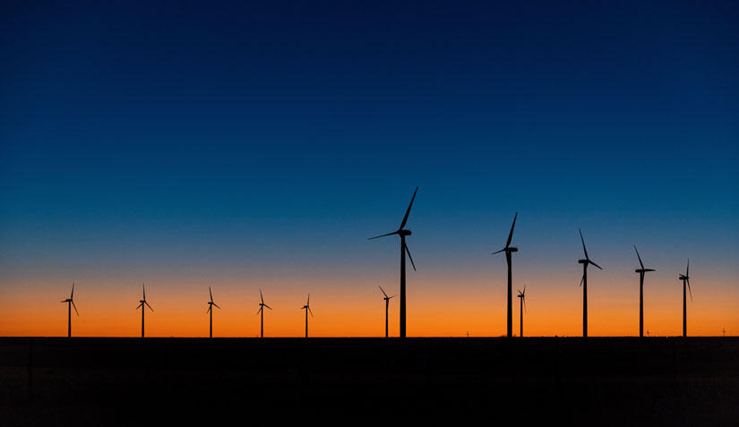 Photo of a wind farm in Texas at sunset.