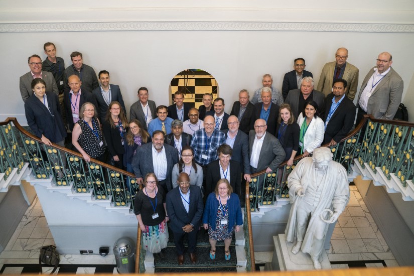 A large group of people standing on a staircase. 