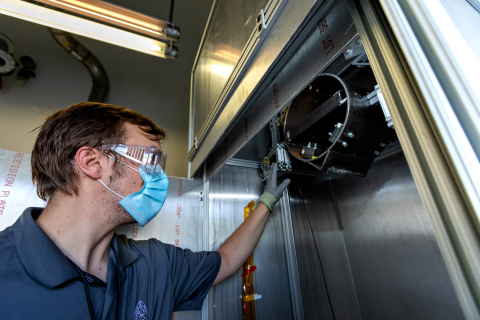 A man operates research equipment. 