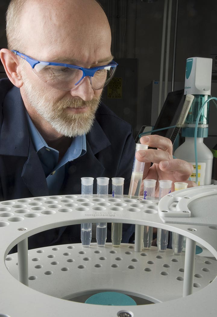 A man using laboratory equipment.