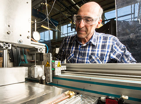 Photo of a man working with equipment in a laboratory