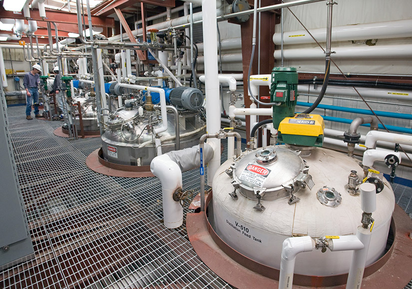 Row of fermenter tanks in a pilot plant facility.