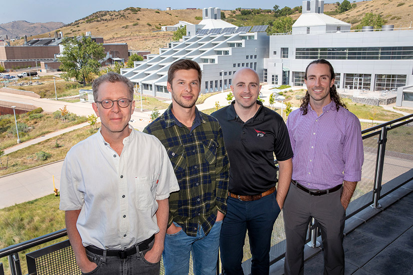 The four scientists who make up the first cohort of the West Gate visit the NREL campus and stand in front of the building where they will spend much of their time.