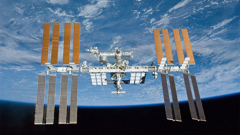 The International Space Station in orbit above the Earth.