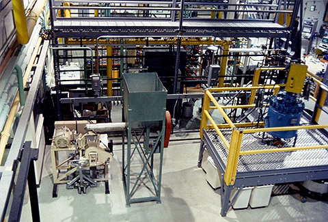 Photo of a biomass pretreatment and fermentation pilot plant inside a large laboratory building