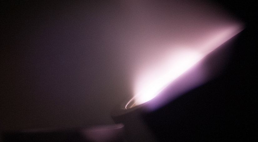 Photo of plasma produced during the sputtering process of coating electrochromic window material