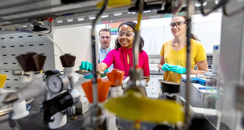 Three researchers in a lab.