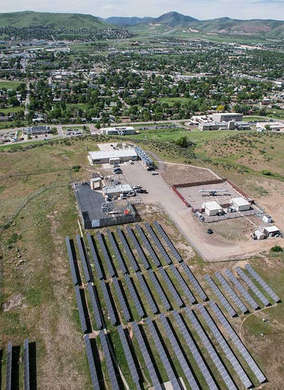 An aerial photo of solar panels and NREL's Golden, Colorado, campus.