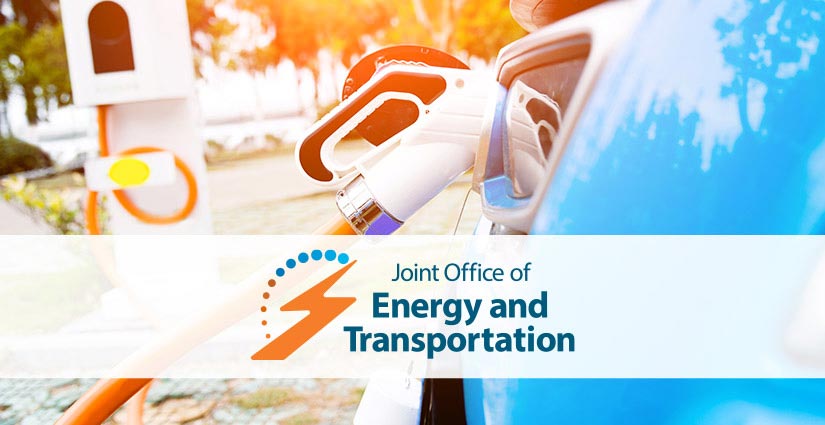 Joint Office of Energy and Transportation text over a photo of an electric car plugged into a charger.