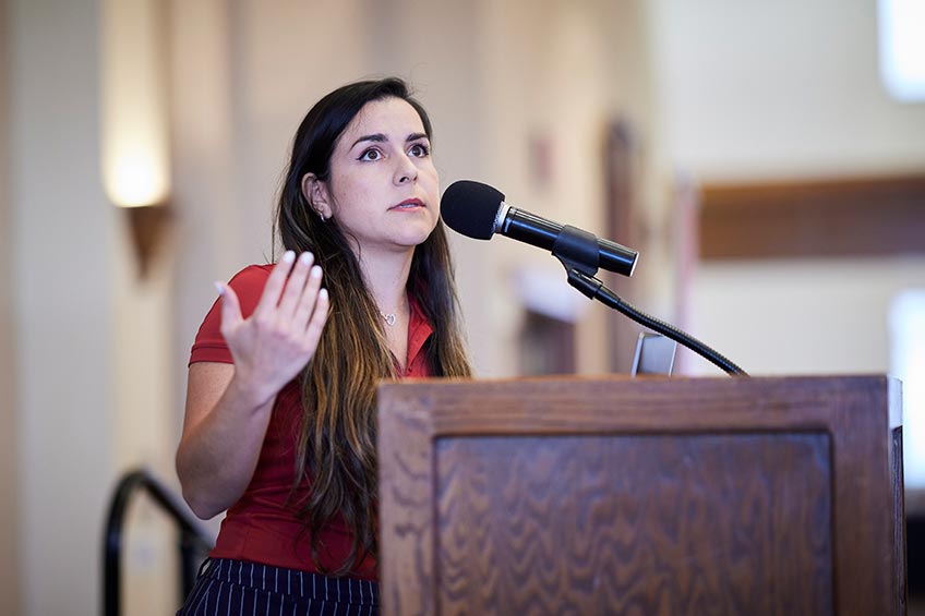 Student speaks at a podium.