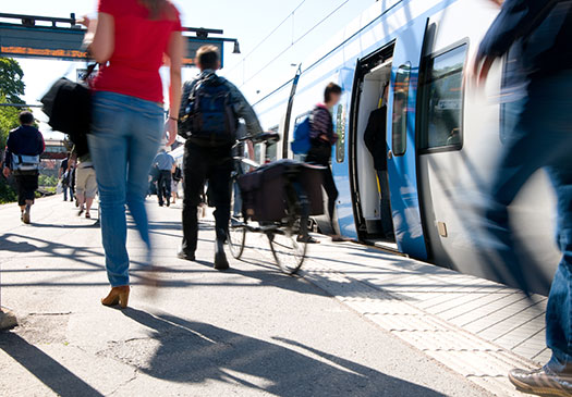 Photo of people walking near train.