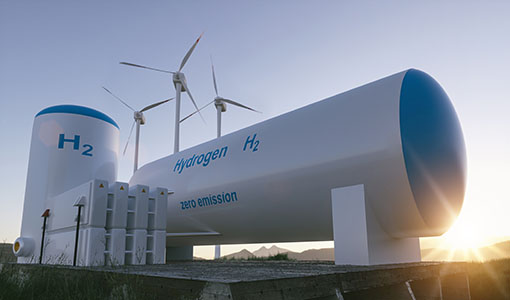 Hydrogen tanks in front of wind turbines