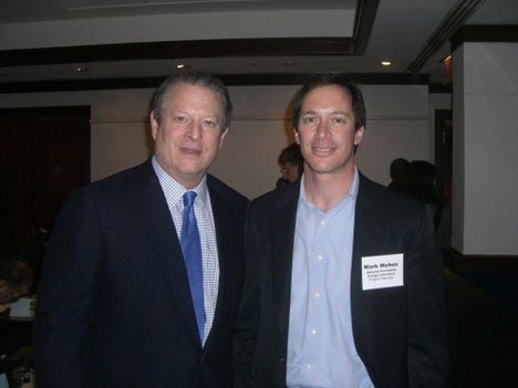 Photo of two men in suit jackets.