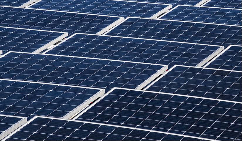 Closeup photo of many solar panels in a PV array