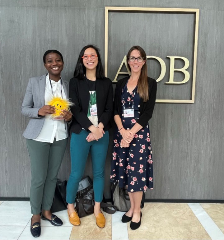 Sika Gadzanku, Derina Man, and Sadi Cox pose for photo inside building.