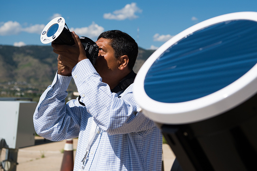 A man holding up a camera.