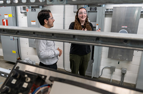 Summer 2023 JUMP into STEM intern Julia Ehlers and her mentor Willie Bernal Heredia discuss research in NREL’s Optimization and Control Laboratory.