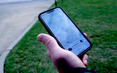 Photo of a phone screen displaying the Arlington On-Demand ride-hailing app.