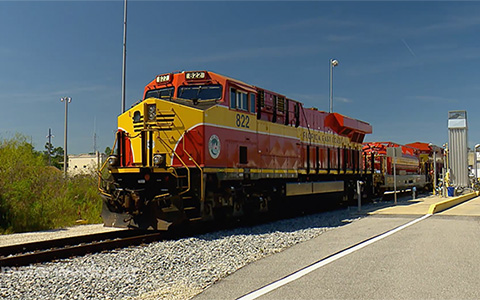Train locomotive on track in railyard