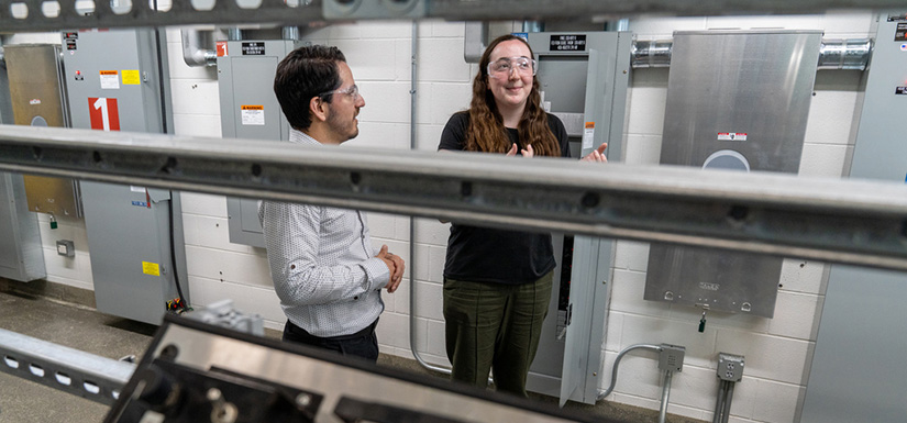 Two people standing in a lab.