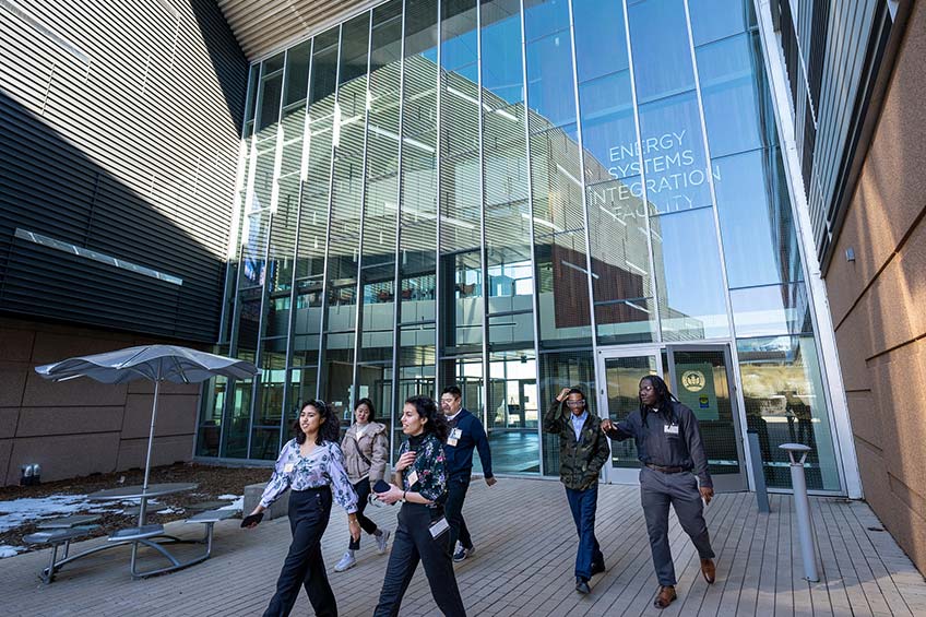 Students walking outside a building.