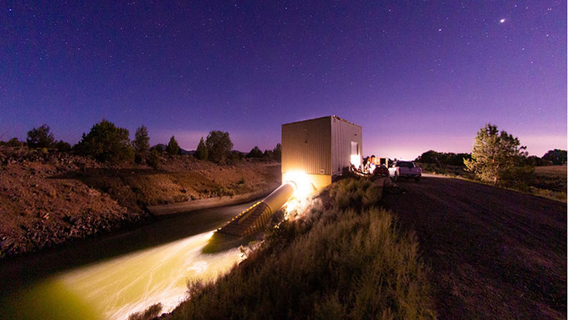 A hydropower facility built on the side of a small river