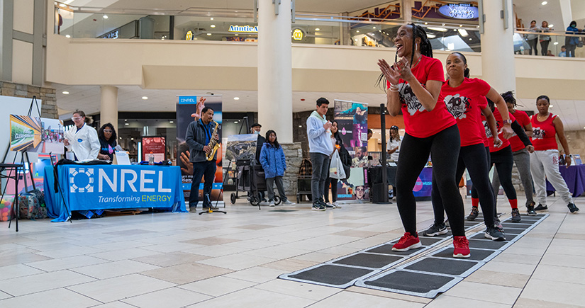 People doing double dutch in a mall. 
