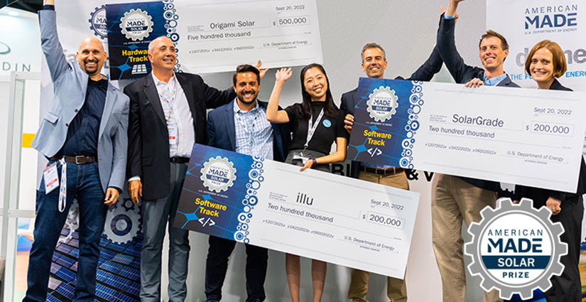 Seven people smiling and waving while holding giant checks.