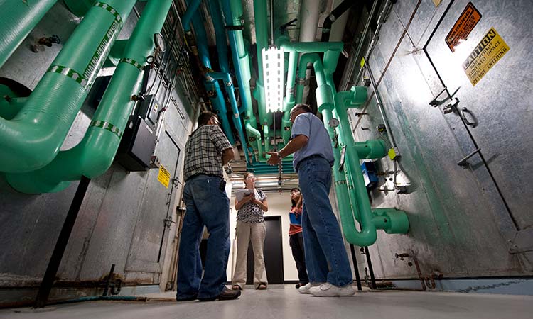 A team of engineers perform an energy audit of large HVAC systems.