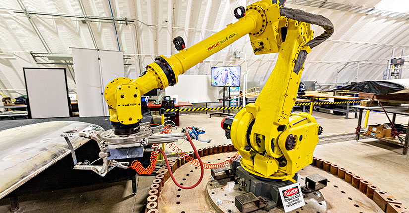 A stock image of a yellow robotic machine.