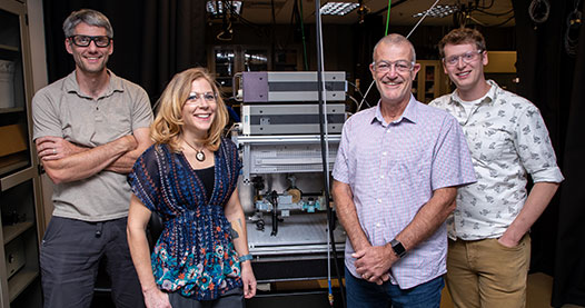 Four researchers smiling.