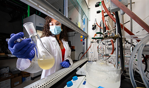 A researcher purifies a catalysts with a sublimation to use in polymerizations for recyclable nylon materials.