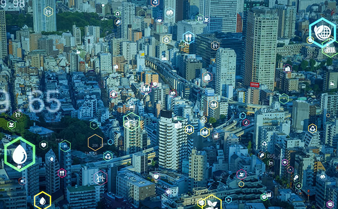 Aerial view of large metropolitan city with energy icons overlayed.