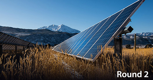 Solar photovoltaic array in a rural area.