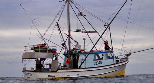 A 46-foot commercial fishing boat named I Gotta cruises the waters outside of Sitka, Alaska.